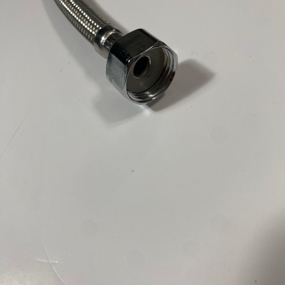 Flexible faucet supply hose 3/8-inch compression fitting on one end and 1/2-in - Picture 2 of 3